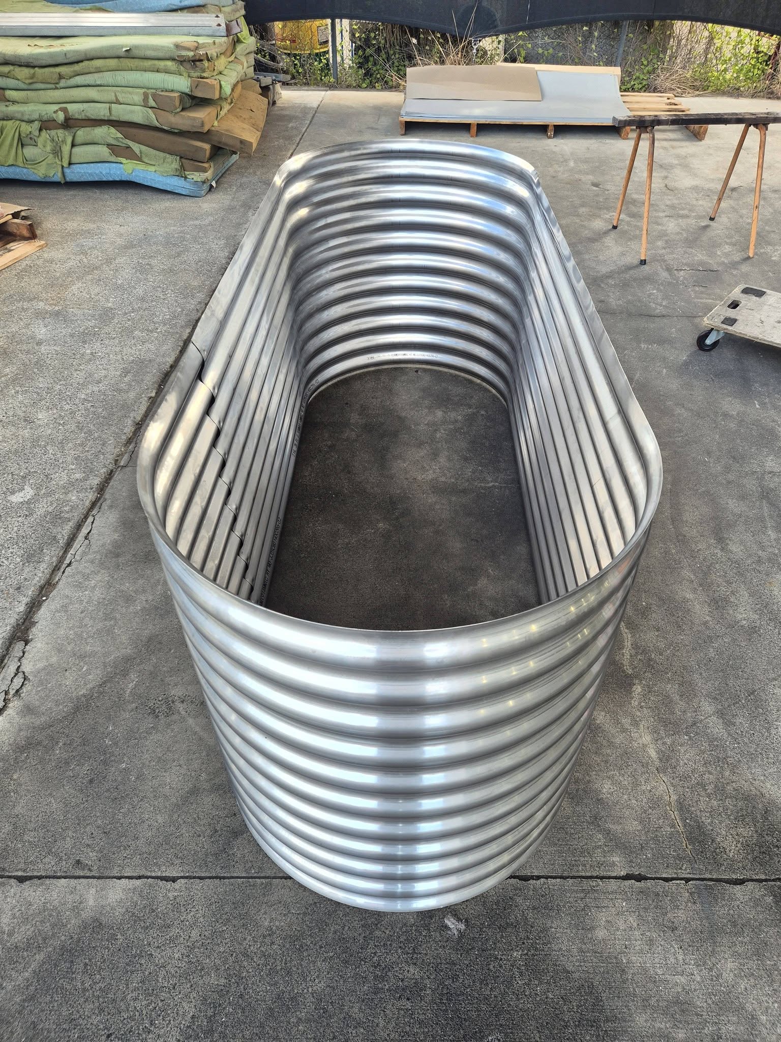 Large stainless steel raised garden bed — top-down view showing interior
